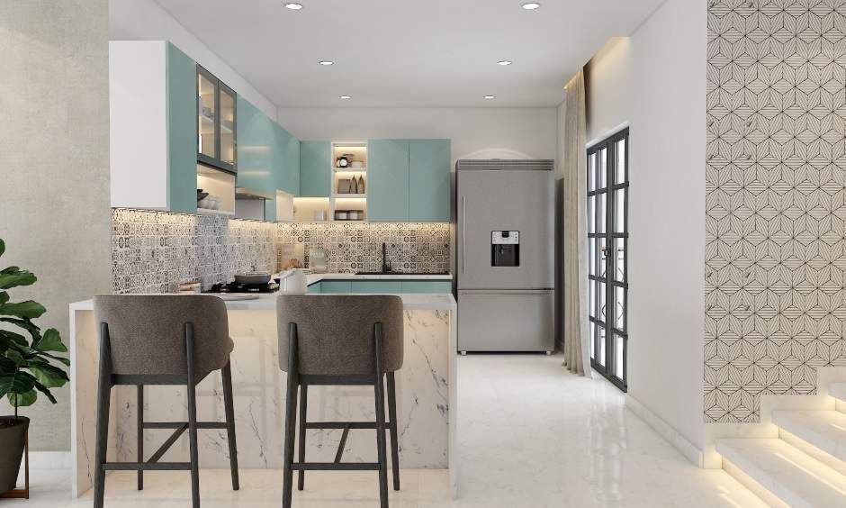 A Spacious Pastel Blue Kitchen With Breakfast Counter (1)